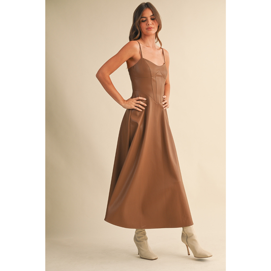 Model wearing Brown Faux Leather Corset Midi Dress with white boots.