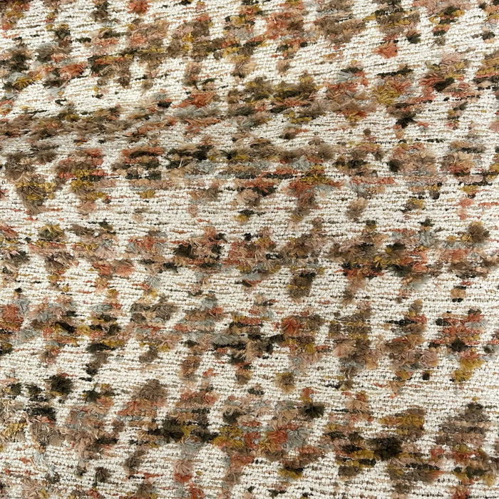 Textured fabric with a pattern of brown, beige, and black colors.