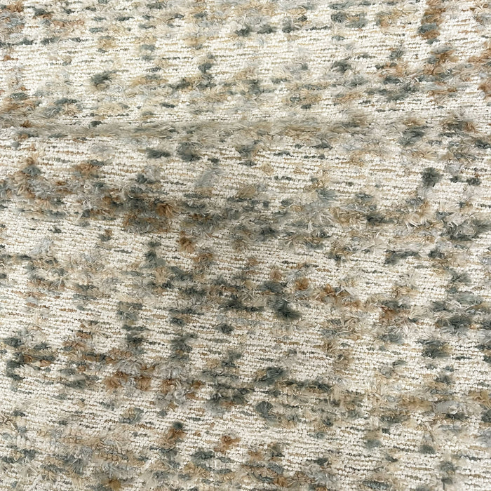 Textured stone surface with a mix of gray, brown, and black colors.
